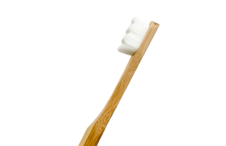 Purifiq's Premium Bamboo Toothbrush floating in the air against a plain white background.